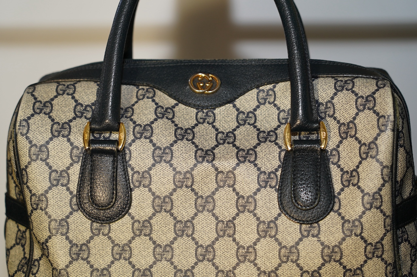 A Gucci monogram blue canvas handbag, wallet and purse